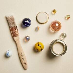 Earthborn Marbles paint with a brush and marbles